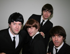 Black suits – Ultimate Beatles Tribute Band